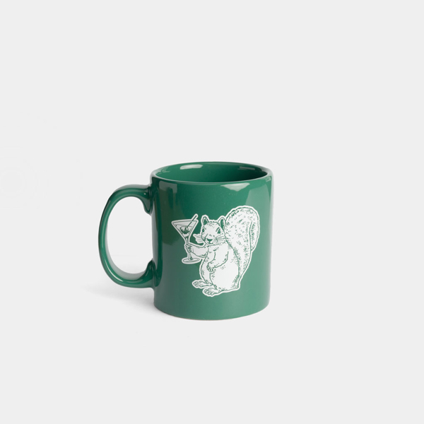 Green mug with white Planet Money squirrel