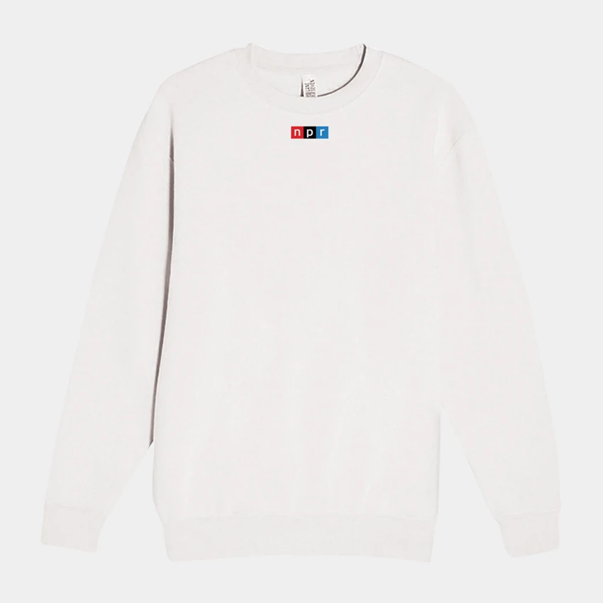 Image of the front f a white crewneck sweatshirt with a small NPR logo on it