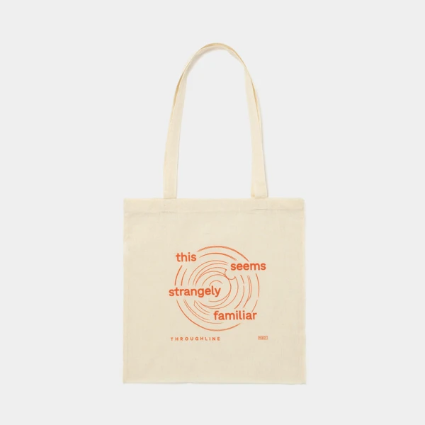 Canvas tote bag with a npr logo and a throughline podcast design with the verbiage "this seems strangely familiar."