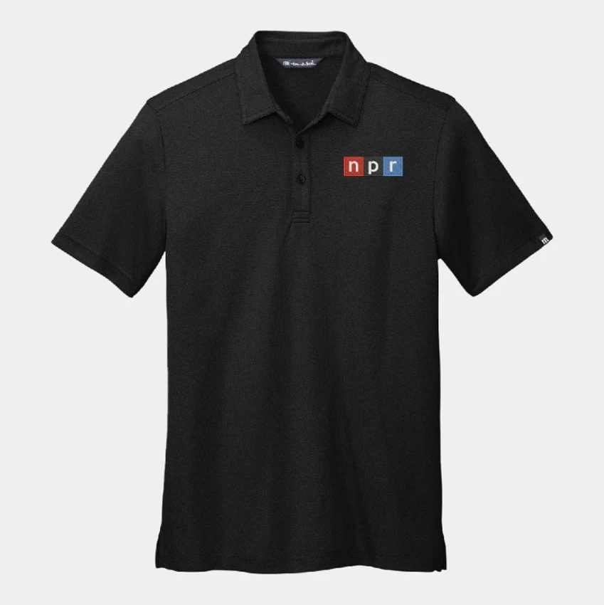 TravisMathew black polo with NPR logo embroidered on the left chest