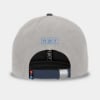 Blue and grey hat with the NPR Wake Up & Listen design embroidered on the front